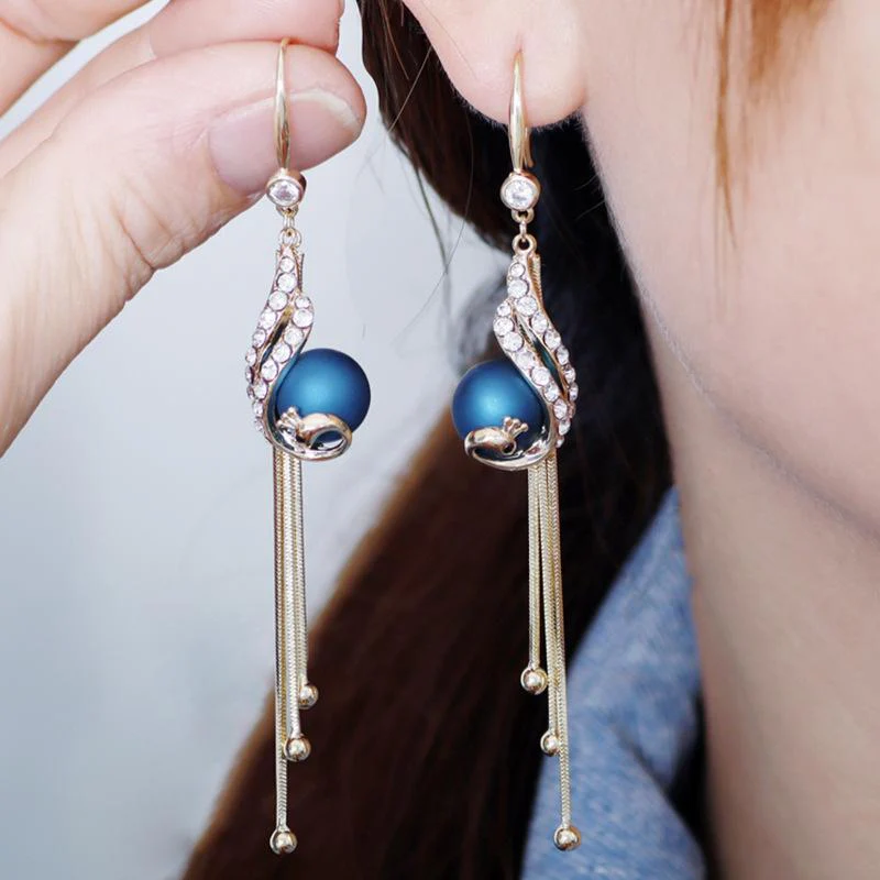 Elegante pauwenoorbellen (2 kleuren) - Image 7