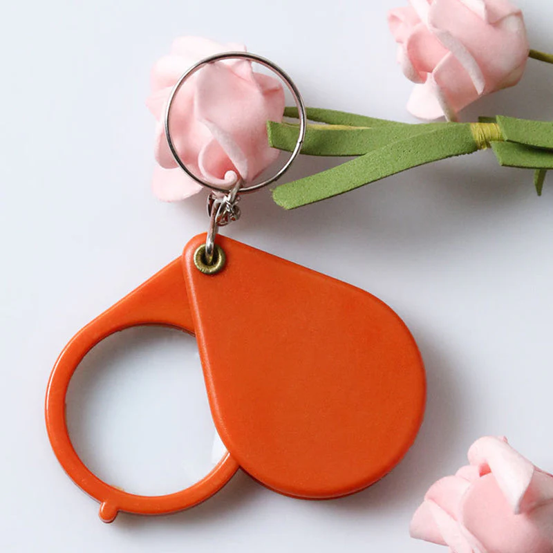 Opvouwbare sleutelhanger met vergrootglas